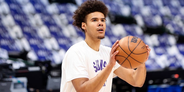 Phoenix Suns forward Cameron Johnson warms up before Game 3 of the second-round playoff series against the Dallas Mavericks, May 6, 2022, at the American Airlines Center in Dallas, Texas.
