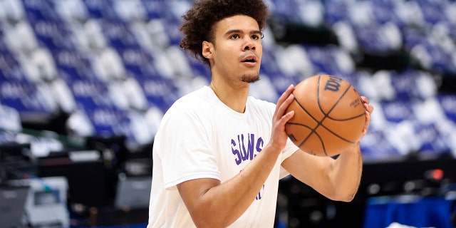 Phoenix Suns forward Cameron Johnson warms up before Game 3 of the second-round playoff series against the Dallas Mavericks, May 6, 2022, at the American Airlines Center in Dallas, Texas.