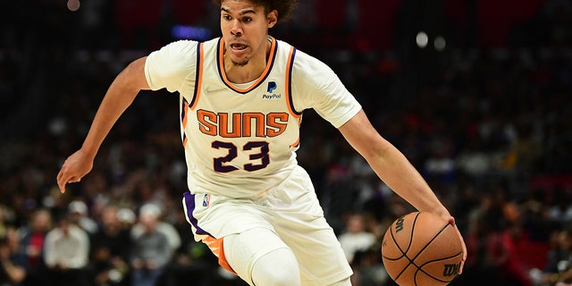 Cameron Johnson of the Phoenix Suns moves the ball against the Los Angeles Clippers at the Crypto.com Arena on April 6, 2022 in Los Angeles, California.