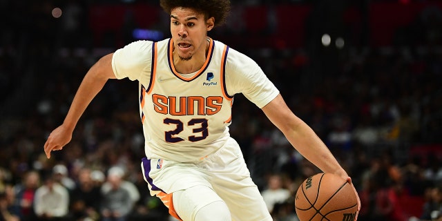 Phoenix Suns' Cameron Johnson moves the ball against the Los Angeles Clippers at Crypto.com Arena, April 6, 2022, in Los Angeles, California.