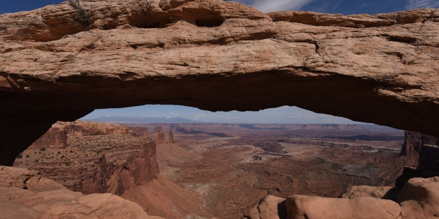 The view through the Mesa Arch in the Canyonlands National Park near Moab, Utah on April 24, 2018.
