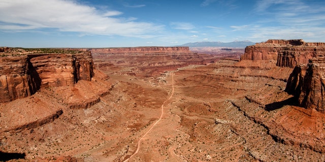 The view from the Shafer Canyon Overlook towards La Sal mountains in Canyonlands National Park in Utah.