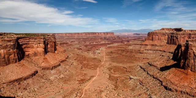 The view from the Shafer Canyon Overlook towards La Sal mountains in Canyonlands National Park in Utah.