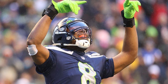 Carlos Dunlap of the Seattle Seahawks reacts during the fourth quarter against the Chicago Bears at Lumen Field in Seattle on Dec. 26, 2021.