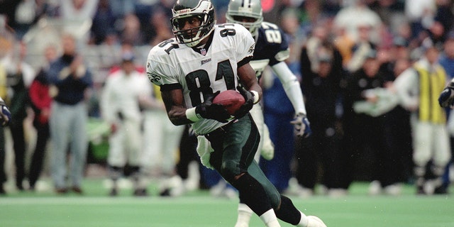 Charles Johnson, #81 of the Philadelphia Eagles, carries the ball during a game against the Dallas Cowboys at the Veterans Stadium in Philadelphia, Pennsylvania Oct. 10, 1999. The Eagles defeated the Cowboys 23-10.