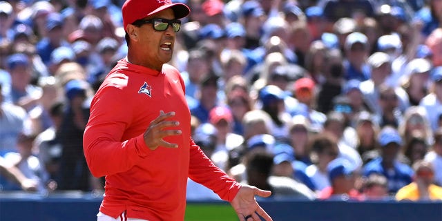 Toronto Blue Jays manager Charlie Montoyo argues a call with first base umpire Ryan Wills in the fourth inning of a baseball game against the New York Yankees in Toronto, Saturday, June 18, 2022.
