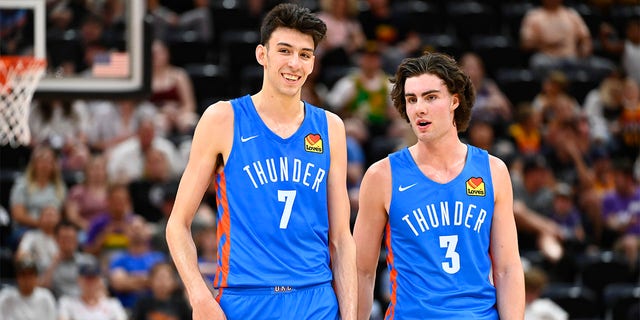 Chet Holmgren #7 of the Oklahoma City Thunder talks to teammate Josh Giddy #3 during an NBA Summer League game against the Utah Jazz at the Vivint Arena on July 5, 2022 in Salt Lake City, Utah. 