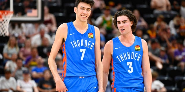 Chet Holmgren #7 of the Oklahoma City Thunder speaks with teammate Josh Giddey #3 during a NBA Summer League game against the Utah Jazz at Vivint Arena on July 05, 2022 in Salt Lake City, Utah. 