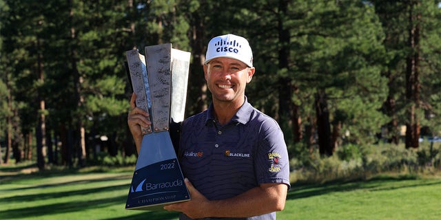 Chaz Reevy of the USA poses with the trophy after winning pitch 18 during the final round of the Barracuda Championship at the Tahoe Mountain Club on July 17, 2022 in Truckee, California. 