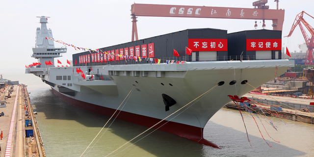 China's third aircraft carrier, the Fujian, named after Fujian Province, is seen during a launching ceremony in Shanghai on June 17.
