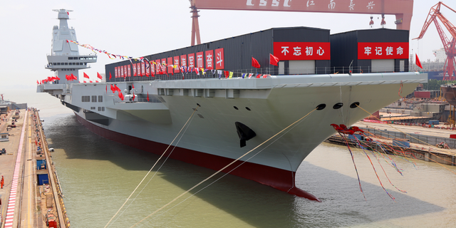 China's third aircraft carrier, the Fujian, named after Fujian Province, is seen during a launching ceremony in Shanghai on June 17.