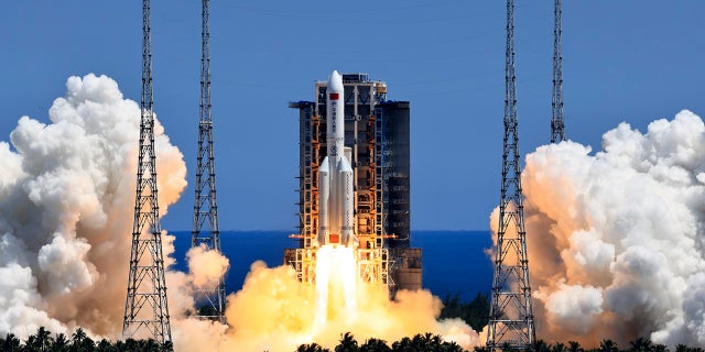 In this photo released by Xinhua News Agency, the Long March 5B Y3 carrier rocket, carrying Wentian lab module blasts off from the Wenchang Space Launch Center in Wenchang in southern China's Hainan Province Sunday, July 24, 2022. On a hot Sunday afternoon, with a large crowd of amateur photographers and space enthusiasts watching, China launched the Wentian lab module from tropical Hainan Island. (Li Gang/Xinhua via AP)