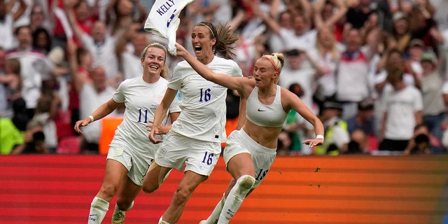 Chloe Kelly of England celebrates her team's second goal against Germany at Wembley Stadium in London, Sunday 31 July 2022.