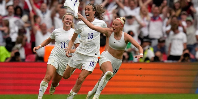 Chloe Kelly of England celebrates her team's second goal against Germany at Wembley Stadium in London, Sunday 31 July 2022.