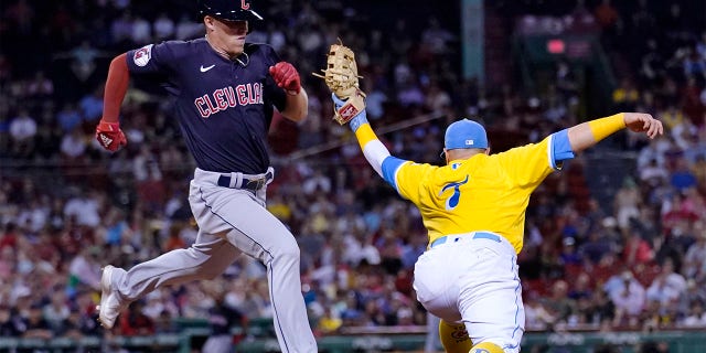 Cleveland Guardians' Myles Straw, left, grounds out to Boston Red Sox first baseman Christian Vazquez, right, during the eighth inning of a baseball game at Fenway Park, Tuesday, July 26, 2022, in Boston.