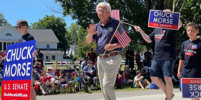 New Hampshire state Senate president Chuck Morse, who's running for the GOP US Senate nomination, marches in the annual Amherst, New Hampshire, Independence Day parade, on July 4, 2022.