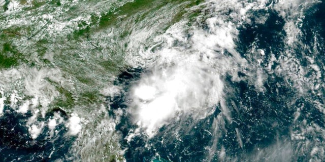 This GOES-East geocolor image provided by NOAA and taken at 11:30 a.m., Saturday, July 2, 2022, shows Tropical Storm Colin of the Atlantic coast of the United States. 