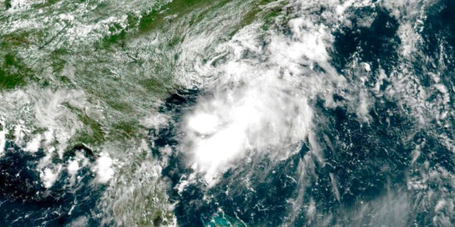 This GOES-East geocolor image provided by NOAA and taken at 11:30 a.m., Saturday, July 2, 2022, shows Tropical Storm Colin of the Atlantic coast of the United States.