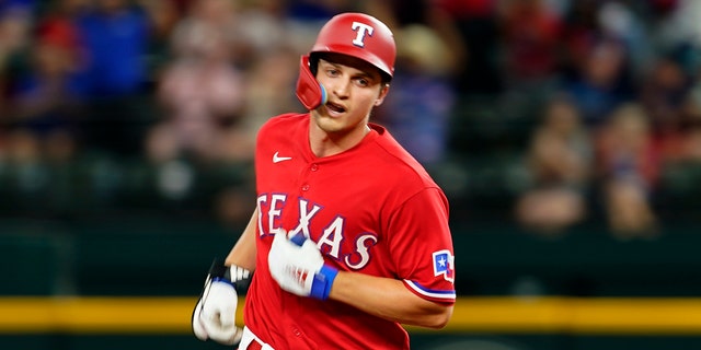 Rangers' Corey Seager runs the bases after hitting a solo home run off Seattle Mariners starting pitcher Robbie Ray on Friday, July 15, 2022, in Arlington, Texas.