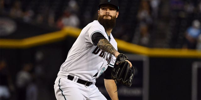 Dallas Keuchel #60 of the Arizona Diamondbacks delivers a pitch against the Colorado Rockies at Chase Field on July 07, 2022 in Phoenix, Arizona.