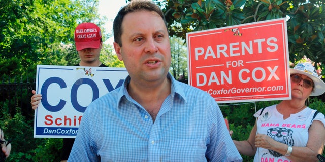 Del. Dan Cox, who is seeking the Republican nomination for governor, talks to reporters, in Annapolis, Maryland, June 30, 2022.