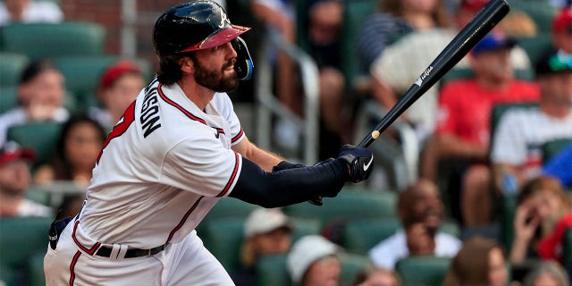 Atlanta Braves' Dansby Swanson watches his three-run RBI during the second inning of a baseball game against the St. Louis Cardinals, Monday, July 4, 2022, in Atlanta.