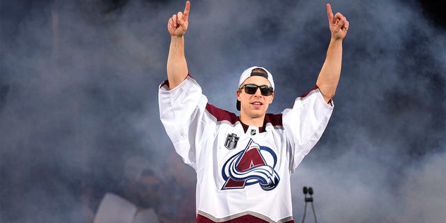 Colorado Avalanche goaltender Darcy Kuemper acknowledges fans during a rally outside the City/County Building for the NHL hockey champions, after a parade Thursday, June 30, 2022, in Denver. 