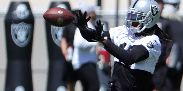 Wide receiver Davante Adams catches a pass at the Las Vegas Raiders Headquarters/Intermountain Healthcare Performance Center on June 7, 2022, in Henderson, Nevada.