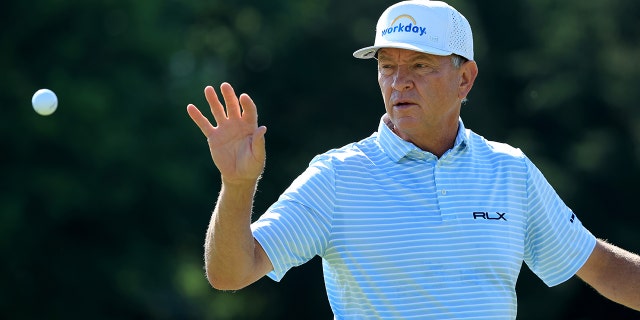 Davis Love III catches a ball during the first round of the Bridgestone Senior Players Championship at Firestone Country Club on July 7, 2022, in Akron, Ohio.