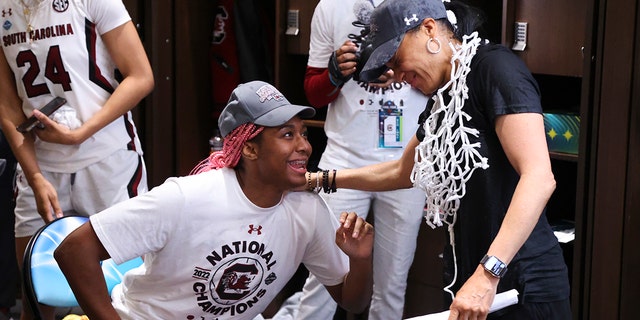 Aliyah Boston #4 of the South Carolina Gamecocks and head coach Dawn Staley of the South Carolina Gamecocks celebrate in the locker room after defeating the UConn Huskies during the championship game of the NCAA Women’s Basketball Tournament at Target Center on April 3, 2022 in Minneapolis, Minnesota.