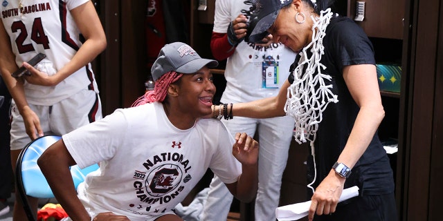 Aliyah Boston #4 of the South Carolina Gamecock and South Carolina Gamecock head coach Don Staley celebrate in the locker room after defeating the UConn Huskies during the championship game of the NCAA Women's Basketball Tournament at Target Center on April 3, 2022 in Minneapolis.  Minnesota.