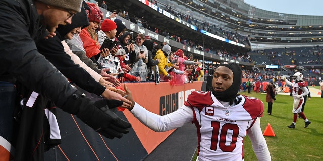DeAndre Hopkins, #10 of the Arizona Cardinals, celebrates with fans after Arizona defeated the Chicago Bears 33-22 at Soldier Field on Dec. 5, 2021 in Chicago.