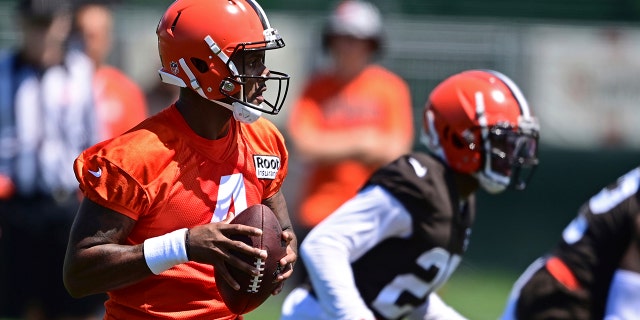 Cleveland Browns quarterback Deshaun Watson drops back to pass during practice in Berea, Ohio, Friday, July 29, 2022.