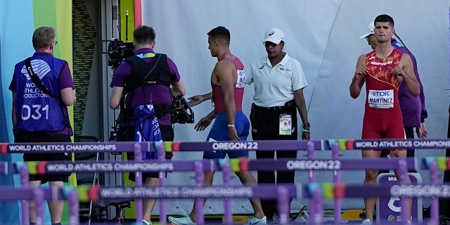 Devon Allen, of the United States, leaves the track after getting disqualified in the 110 men's hurdles final at the World Athletics Championships on Sunday, July 17, 2022, in Eugene, Ore.