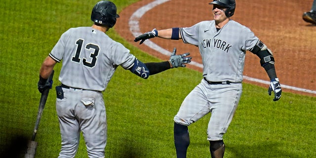 New York Yankees' Josh Donaldson, right, celebrates with Joey Gallo after hitting a solo home run off Pittsburgh Pirates starting pitcher Mitch Keller during the sixth inning of a baseball game in Pittsburgh, Wednesday, July 6, 2022.