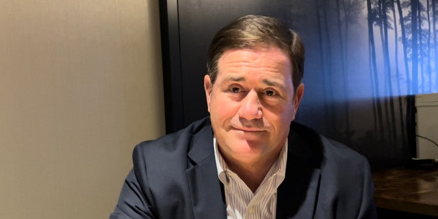Republican Gov. Doug Ducey of Arizona is suing the Biden administration over an order to remove shipping containers used to fill gaps at the southern border.