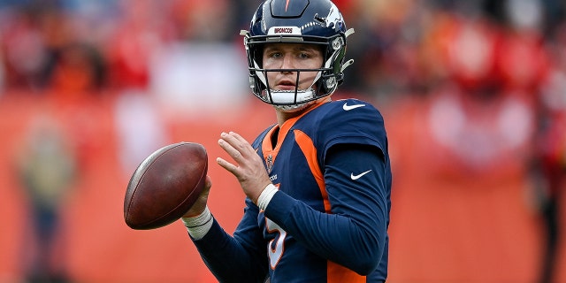 Drew Lock of the Broncos warms up before facing the Kansas City Chiefs at Empower Field At Mile High on Jan. 8, 2022, in Denver, Colorado.