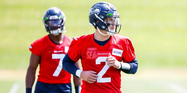 Seattle Seahawks quarterback Drew Lock participates in a drill during an OTA workout at the Virginia Mason Athletic Center in Renton, Washington, on May 23, 2022.