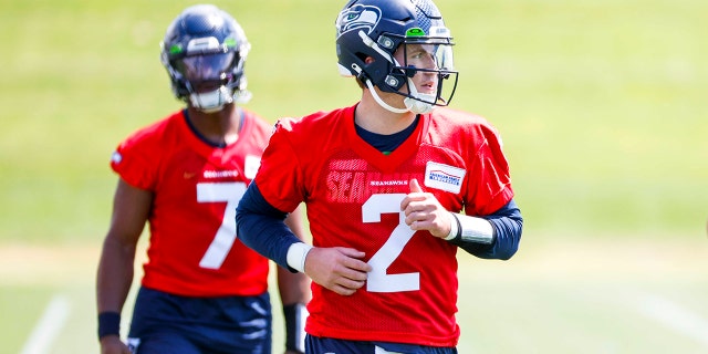 Seattle Seahawks quarterback Drew Lock participates in a drill during an OTA workout at the Virginia Mason Athletic Center in Renton, Washington, on May 23, 2022.