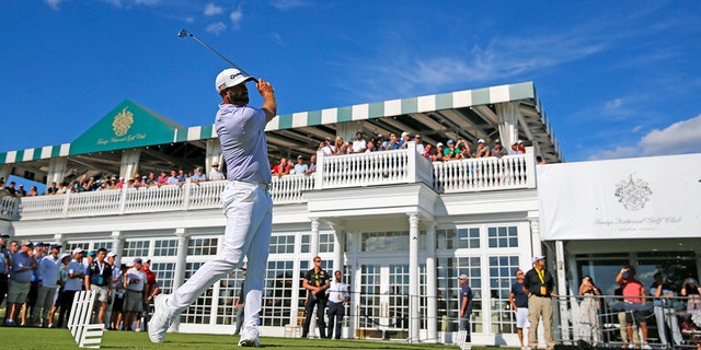 Dustin Johnson plays his shot during the LIV Golf Invitational at on July 30, 2022, in Bedminster, New Jersey.
