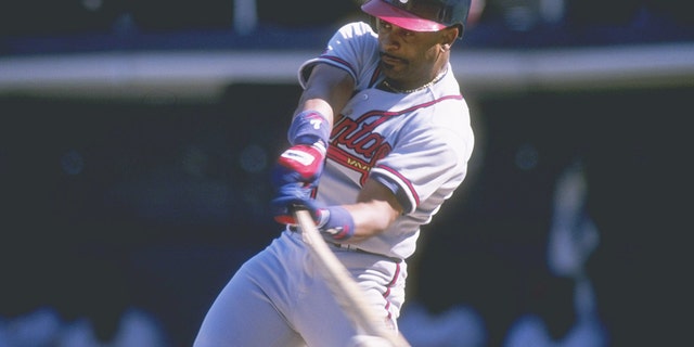 FILE - Outfielder Dwight Smith of the Atlanta Braves swings during a game against the San Diego Padres at Jack Murphy Stadium in San Diego.