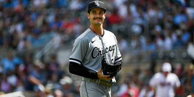 Chicago White Sox pitcher Dylan Cease smiles as he heads to the dugout after finishing the seventh inning allowing one hit against the Minnesota Twins during a baseball game, Sunday, July 17, 2022, in Minneapolis. 