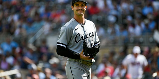 Chicago White Sox pitcher Dylan Cease smiles as he heads to the dugout after finishing the seventh inning allowing one hit against the Minnesota Twins during a baseball game, Sunday, July 17, 2022, in Minneapolis.