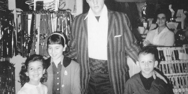 Elvis Presley with a young Hal Lansky (right).