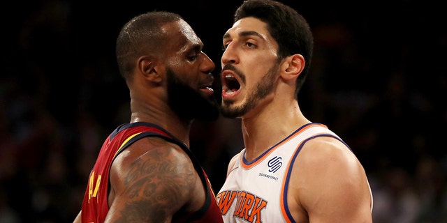 LeBron James #23 and Enes Kanter #00 exchange words at Madison Square Garden.