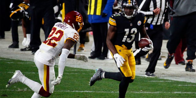 James Washington #13 of the Pittsburgh Steelers in action against Deshazor Everett #22 of the Washington Football Team on December 8, 2020 at Heinz Field in Pittsburgh, Pennsylvania.