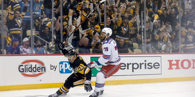 Evgeni Malkin #71 of the Pittsburgh Penguins reacts after scoring a goal during the second period in Game Six of the First Round of the 2022 Stanley Cup Playoffs against the New York Rangers at PPG PAINTS Arena on May 13, 2022 in Pittsburgh, Pennsylvania.