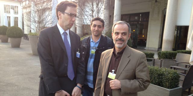 LAUSANNE, SWITZERLAND- MARCH 18: Alan Eyre, left, the Persian language spokesman for the US State Department speaks with Iranian reporters during the Iran nuclear talks in Lausanne, Switzerland, March 18, 2015. 