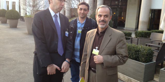 Alan Eyre, left, the Persian language spokesman for the US State Department speaks with Iranian reporters during the Iran nuclear talks in Lausanne, Switzerland, March 18, 2015. 