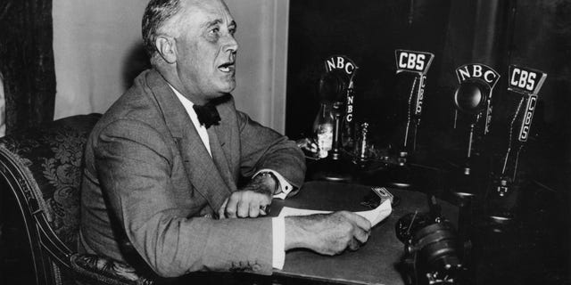 President Franklin Delano Roosevelt is shown delivering one of him "Fireside chat" Radio broadcast of this 1930s photo. 
